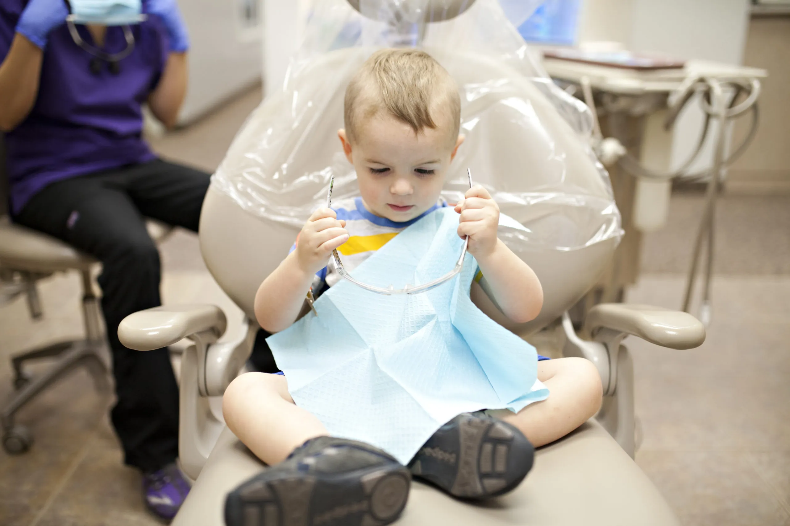 kids at the dentist getting teeth cleaned