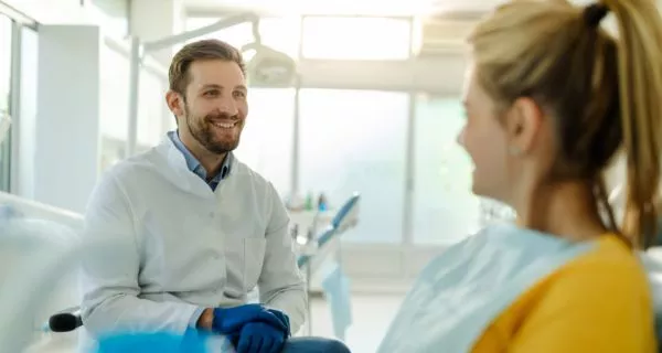 Who should talk to their doctor before getting implants?